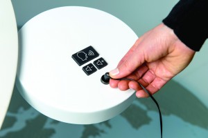 The UKP-A is a tactile button pad that facilitates volume control and access to described video