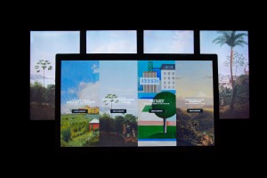 A multitouch wall displays the starting screen for the interactive, Landscapes Carry Meaning.
