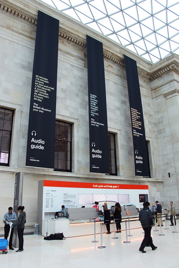 The newly designed audio guide retail desk with marketing banners and multi-screen video