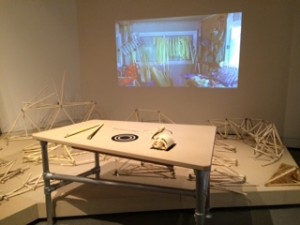 Interactive workbench where visitors explore Theo's fossils. He appears when a fossil is placed on the target.